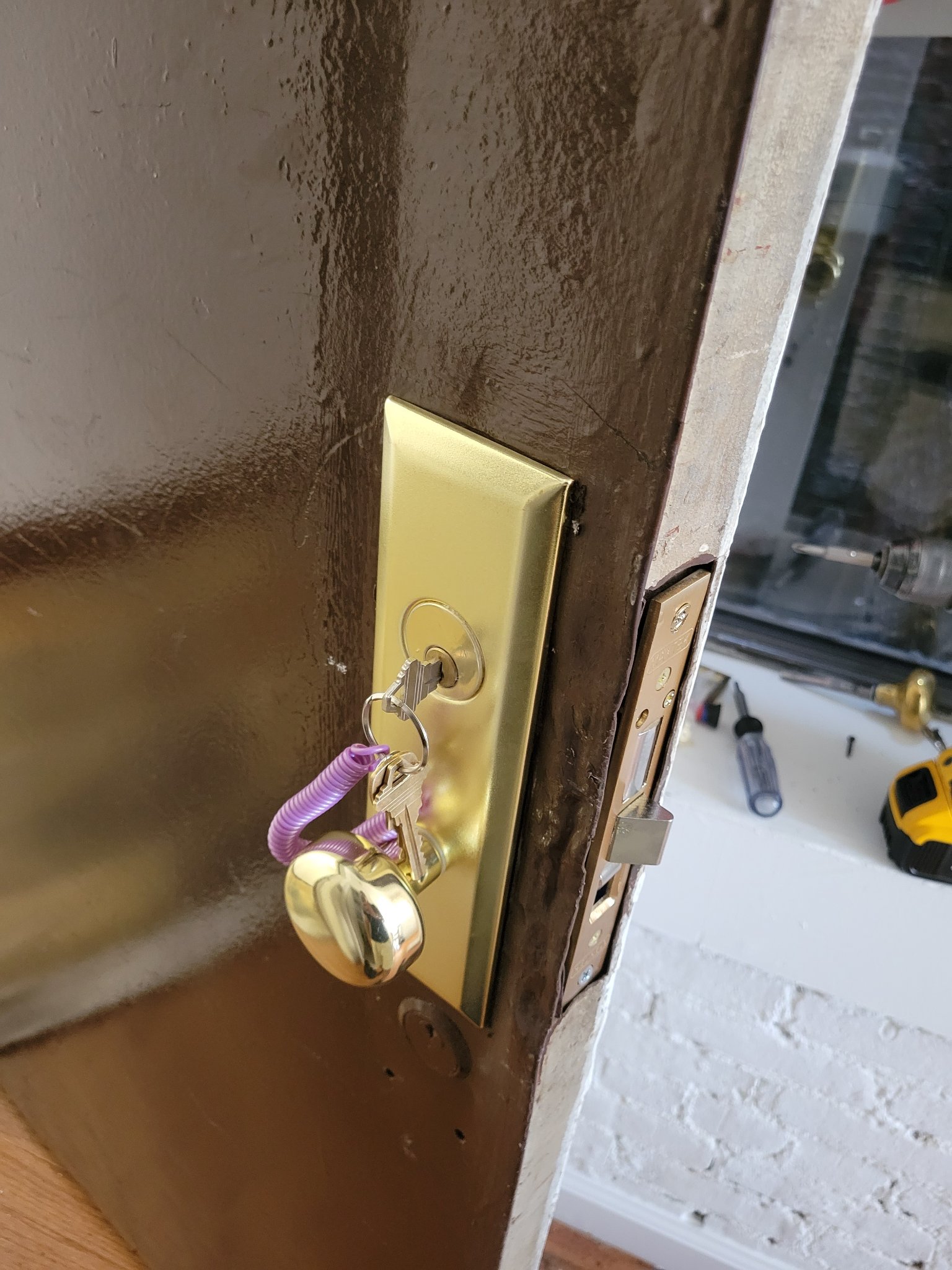 Brass knob and mortise lock with freshly cut keys