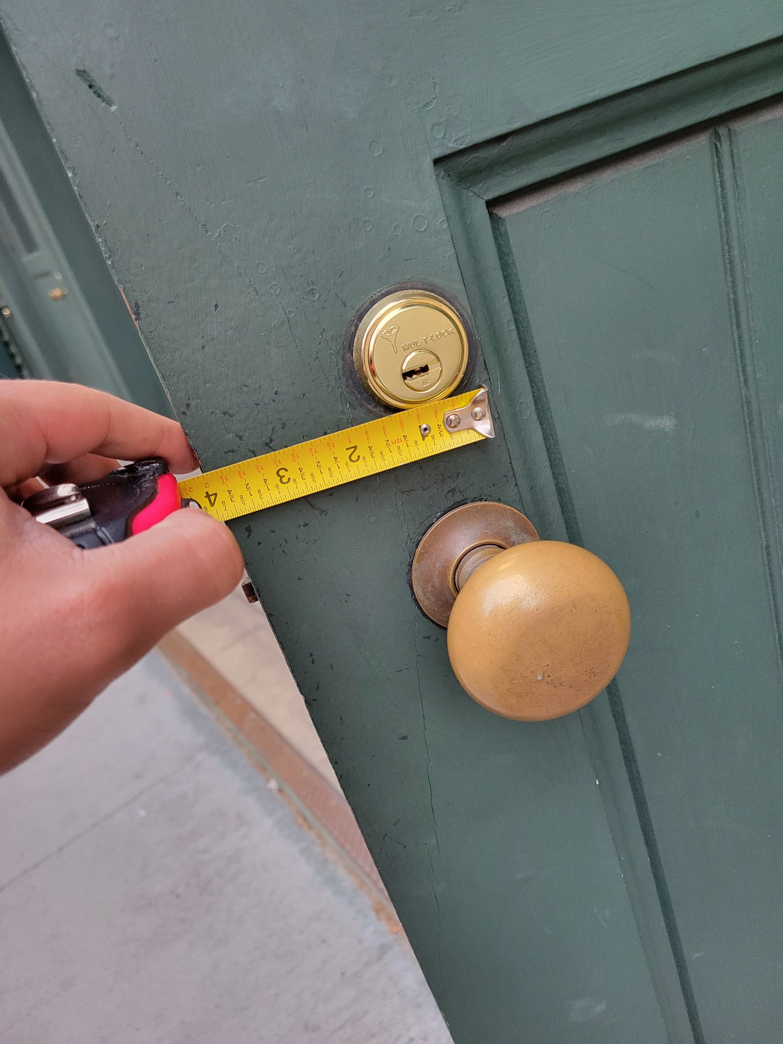 Measuring for a Mul-T-Lock high-security deadbolt