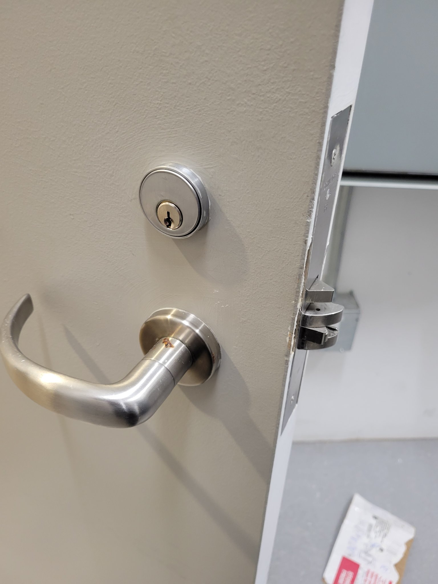 Deadbolt and lever installation on a commercial door